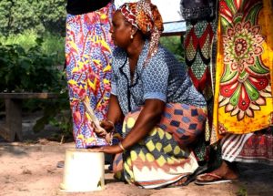 Woman using a bucket as percussion