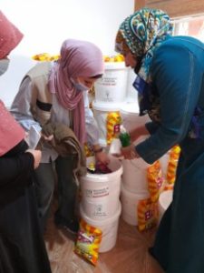 Nardin distributing hygiene kits as part of an APS project in Irbid, Jordan